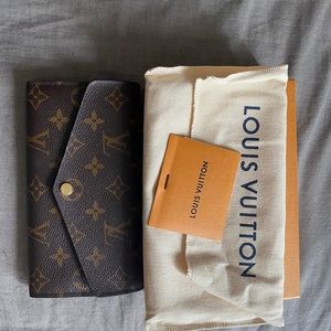 Authentic Louis Vuitton Sarah wallet w/ monogram.